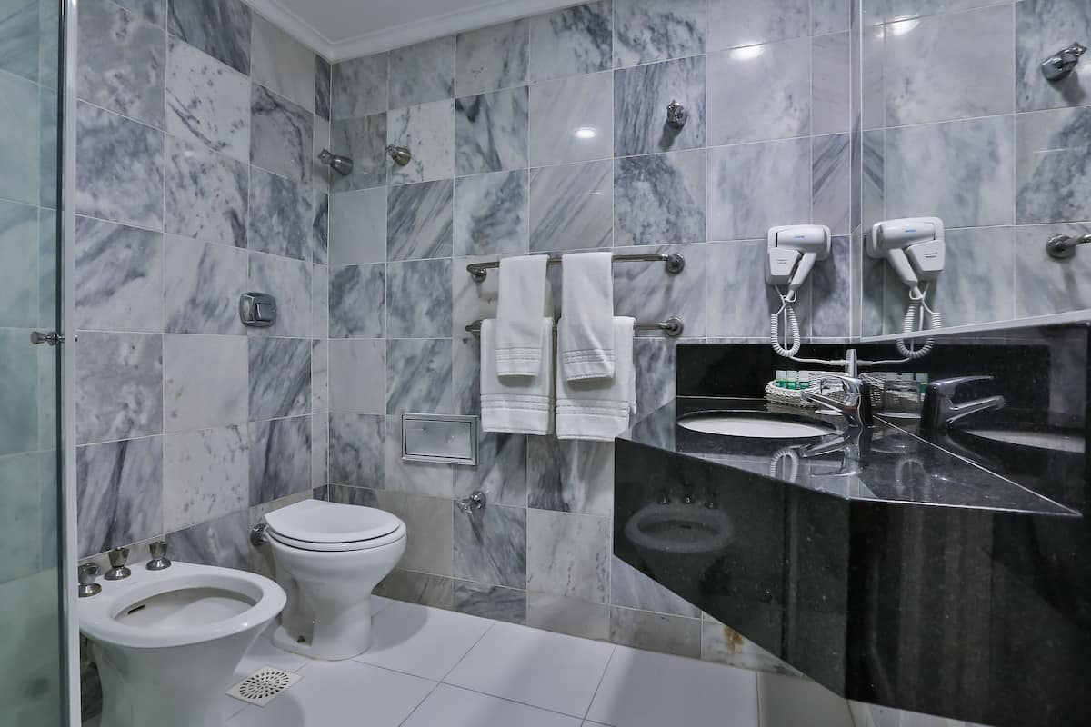 deluxe suite, sea view | bathroom | designer toiletries, hair dryer, towels, soap