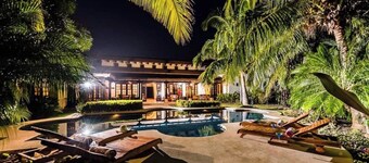 Spacious 4BR home with a private bathroom in every room, large pool, lush gardens, and a terrace with pool views.