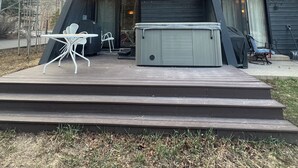 A two-story house with a balcony, outdoor seating, and a hot tub. - Negotiable! Hot tub, new kitchen and master bath.  (Frisco)