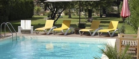 Seasonal outdoor pool, a heated pool, pool umbrellas, sun loungers