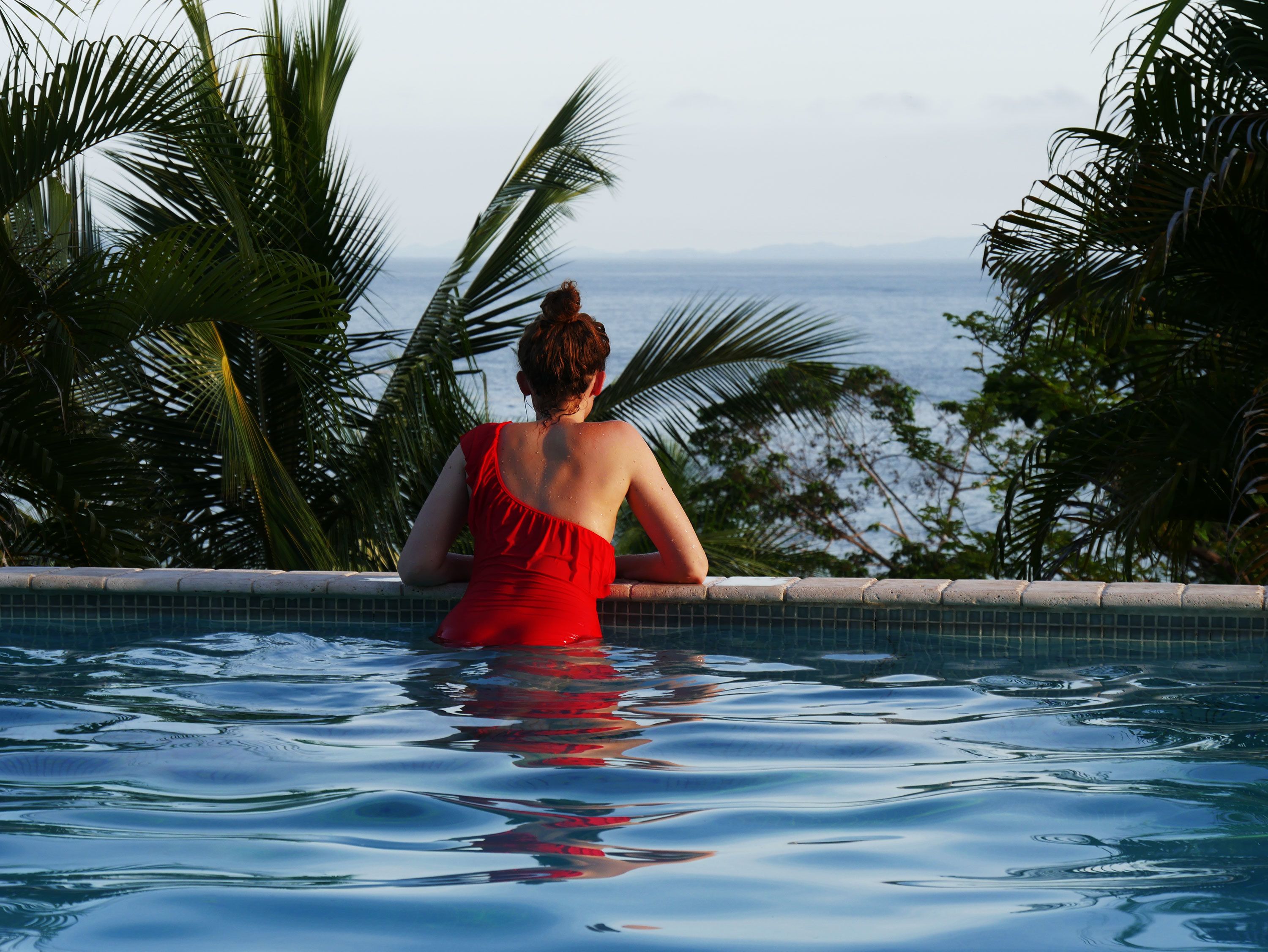 Outdoor pool, open 7 AM to 6:30 PM, pool loungers