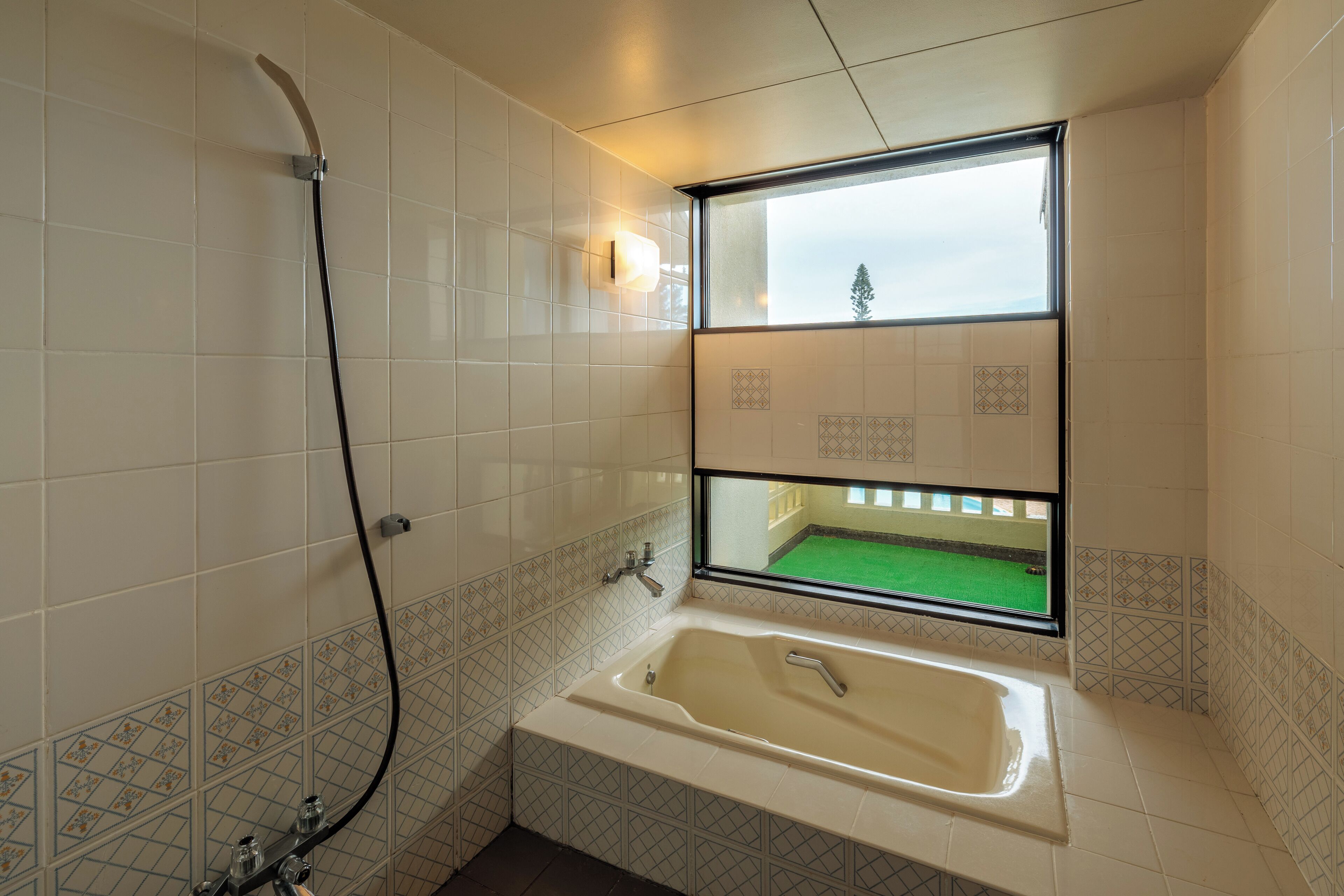 junior suite | bathroom | free toiletries, hair dryer, slippers, electronic bidet