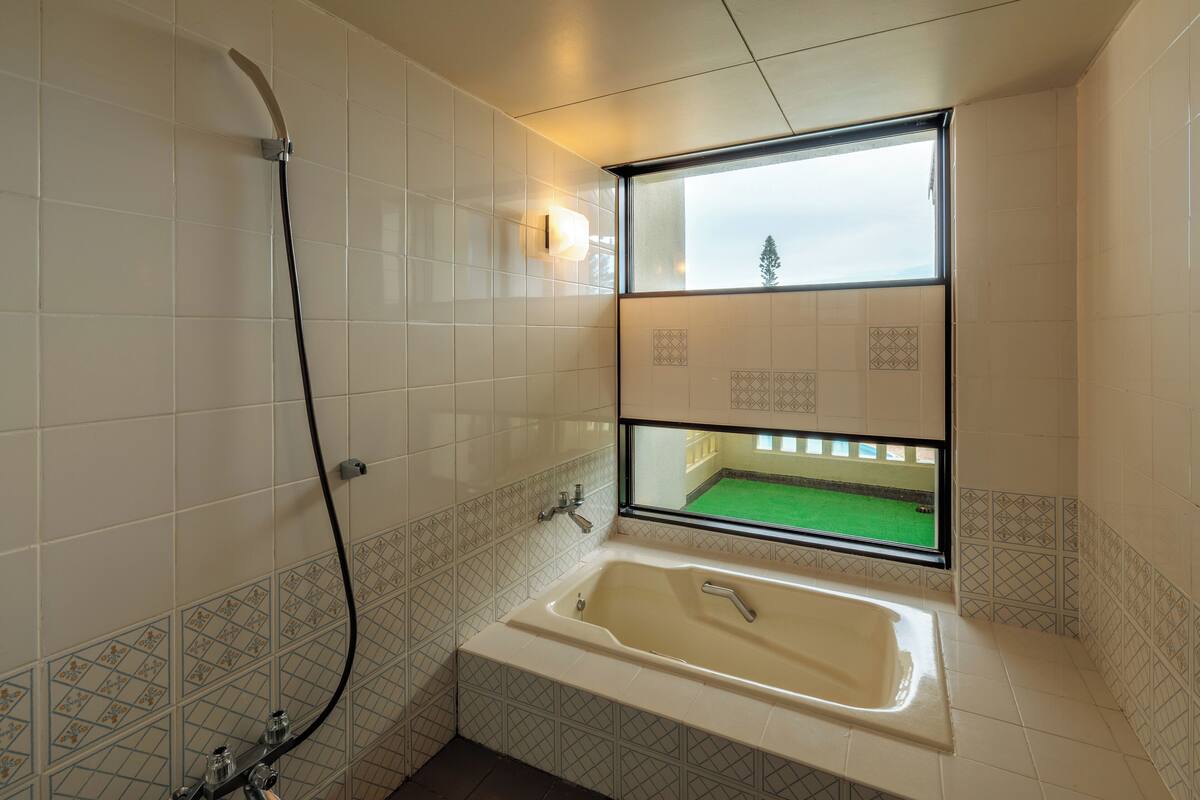 junior suite | bathroom | free toiletries, hair dryer, slippers, electronic bidet
