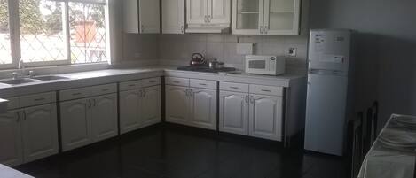 Fridge, microwave, stovetop, cookware/dishes/utensils