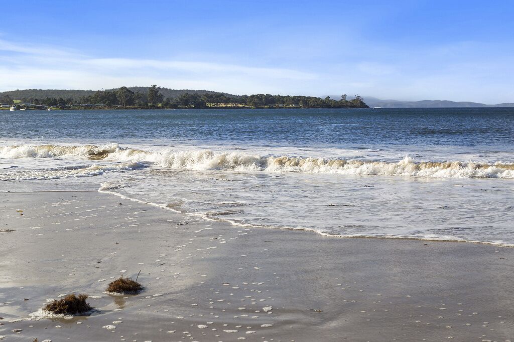 On the beach, sun-loungers