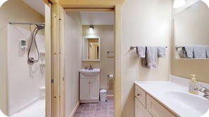 Shower, hair dryer, towels, shampoo
