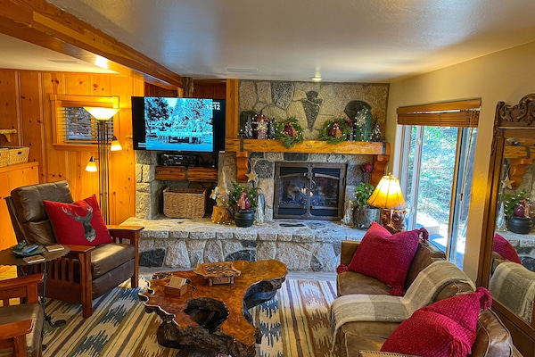 Comfortable leather couch and chairs with designer pillows.