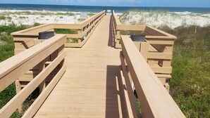 A wooden boardwalk leading to a beach with a clear view of the ocean. - Live the Beach Life! Stay in our FUN & AMAZING Townhome! (St Augustine)