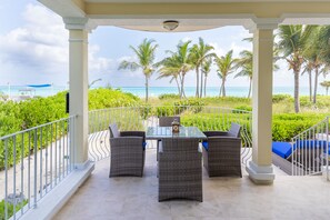 Outdoor dining - Beach Front Luxury Condo in the Heart of Grace Bay at Villa Renaissance.  (Grace Bay)