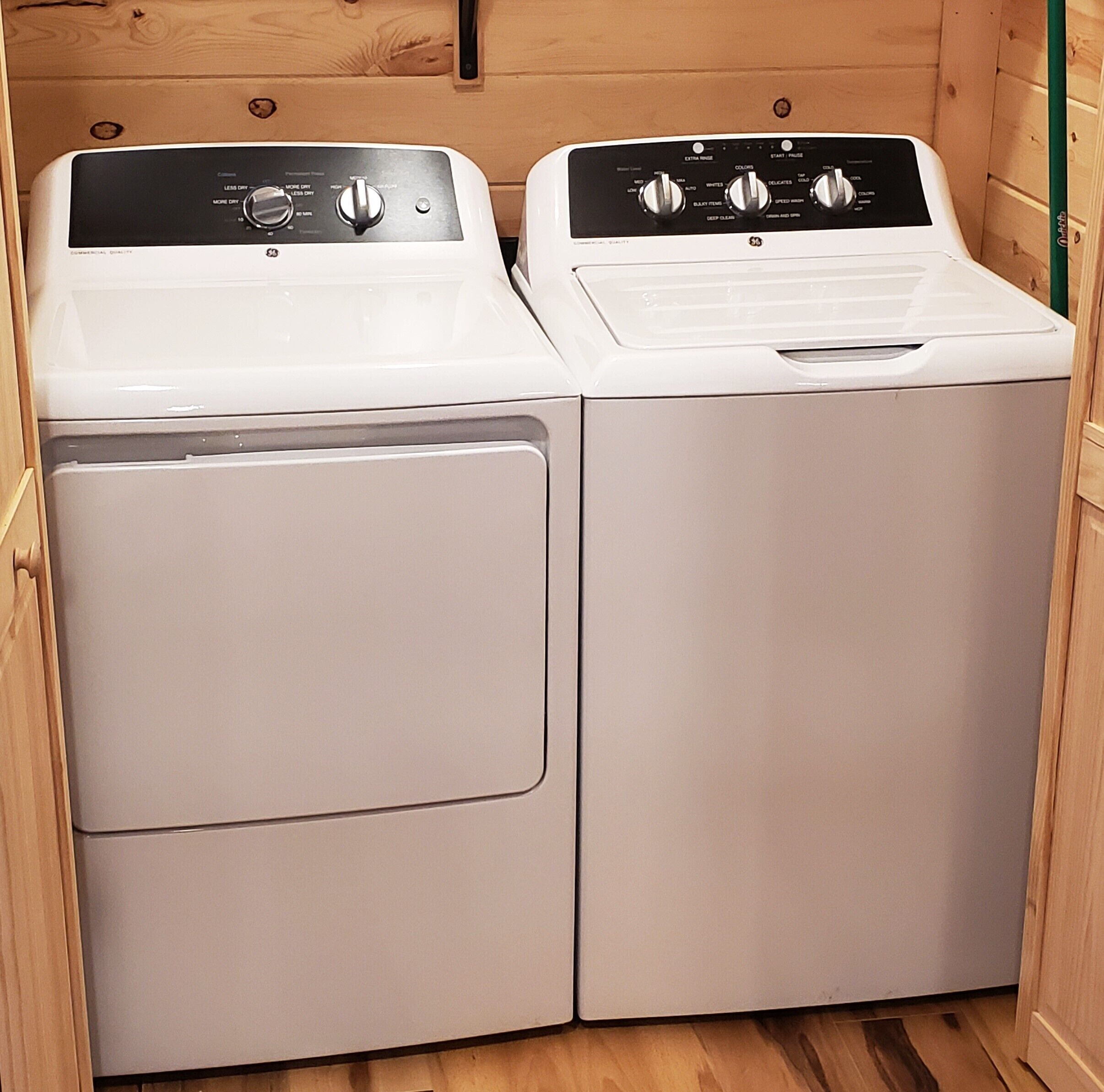 A laundry room with two stacked washing machines.