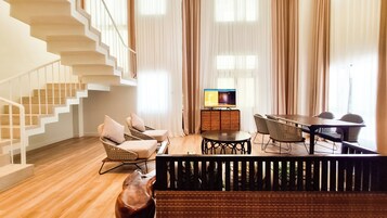 Family Suite | Living area | Flat-screen TV