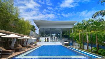 Outdoor pool, open 7 AM to 10 PM, pool umbrellas, pool loungers