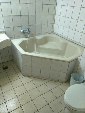 Classic Quadruple Room, 2 Double Beds, Non Smoking | Bathroom | Separate tub and shower, spring water tub, free toiletries, slippers