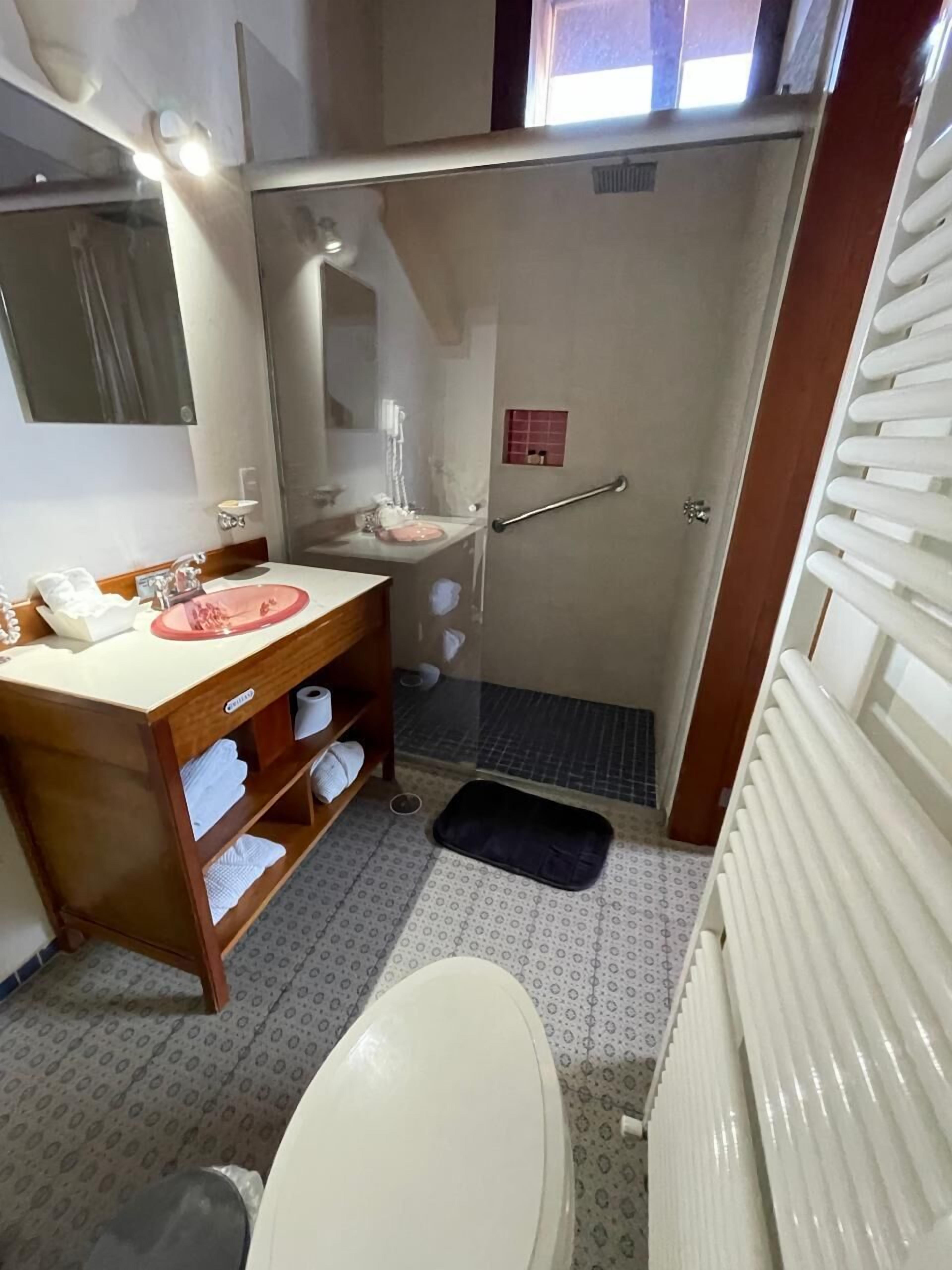 superior room | bathroom | shower, hair dryer, towels, soap