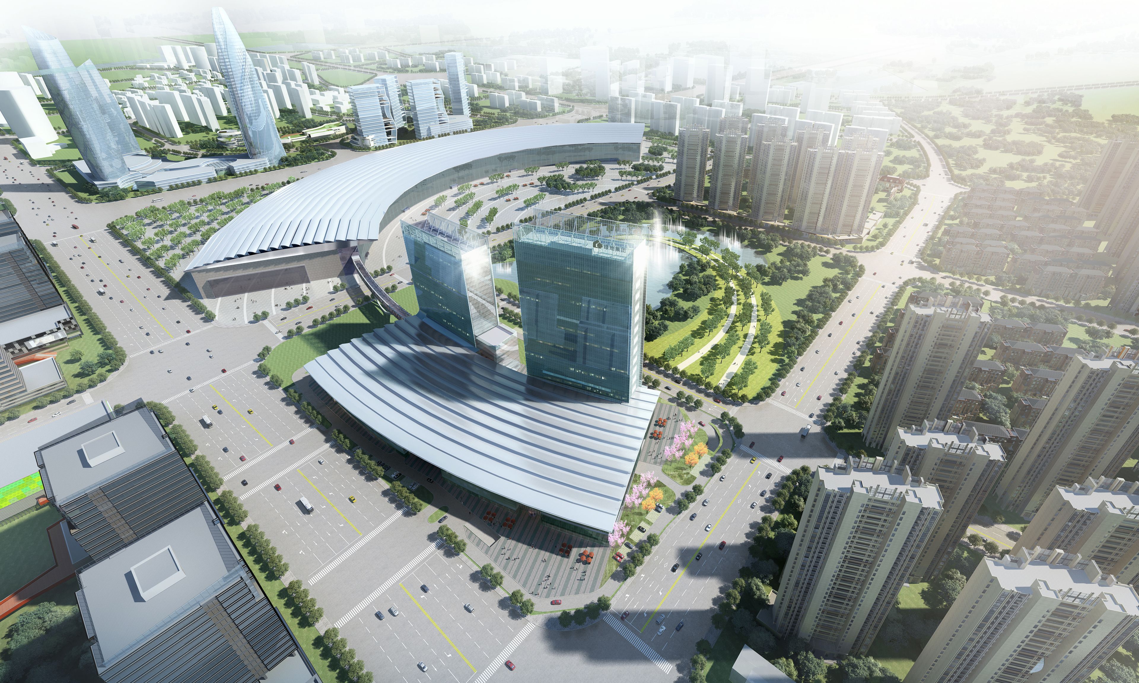 Un desarrollo urbano moderno con edificios altos, una estructura arquitectónica curva y una red vial bien planificada.