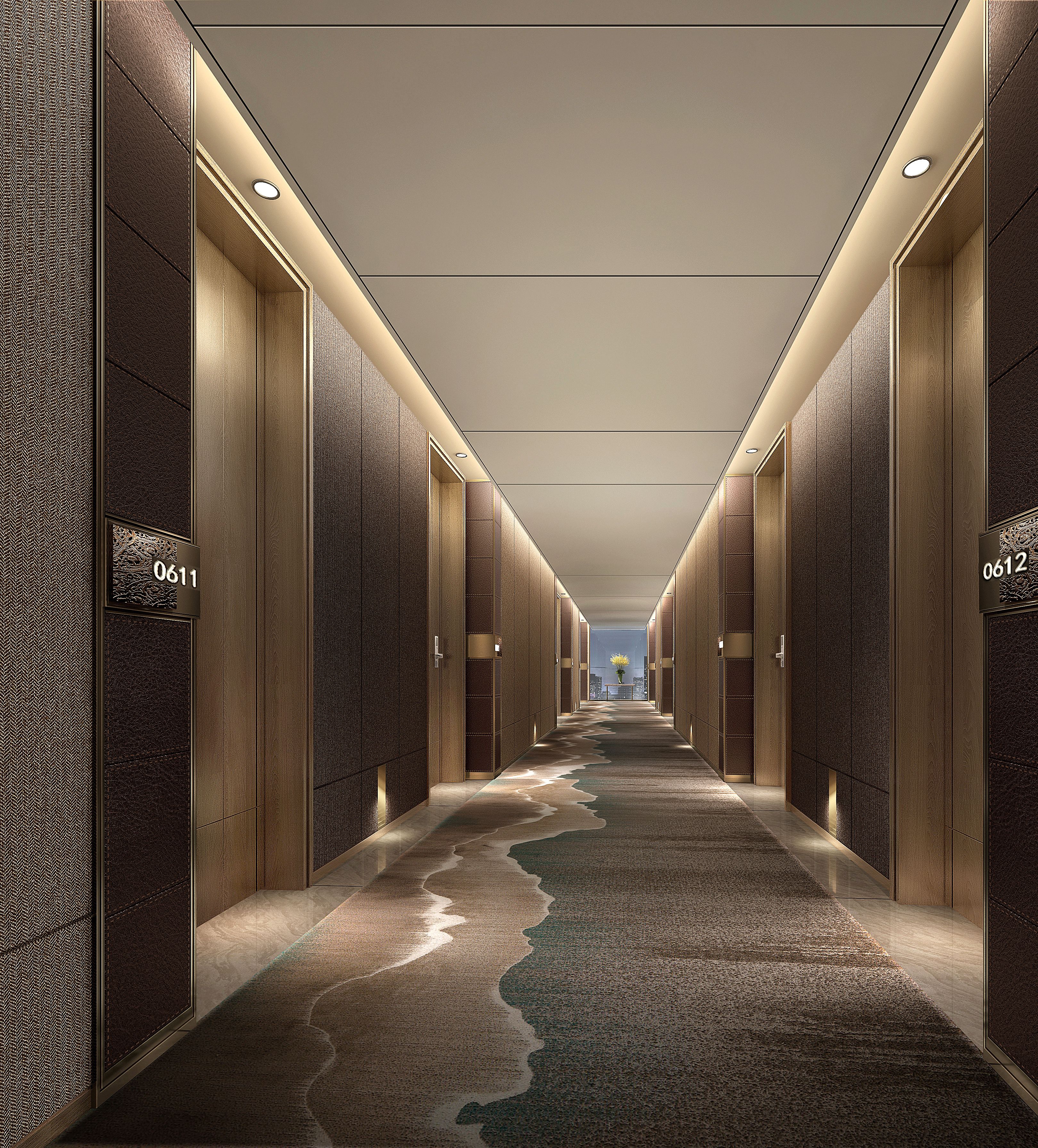 A hallway with a patterned carpet, wooden paneling, and illuminated ceiling lights.