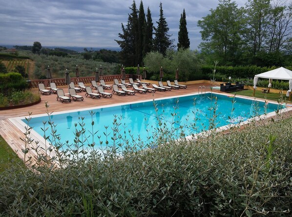 Seasonal outdoor pool, open 8 AM to 7:00 PM, pool umbrellas