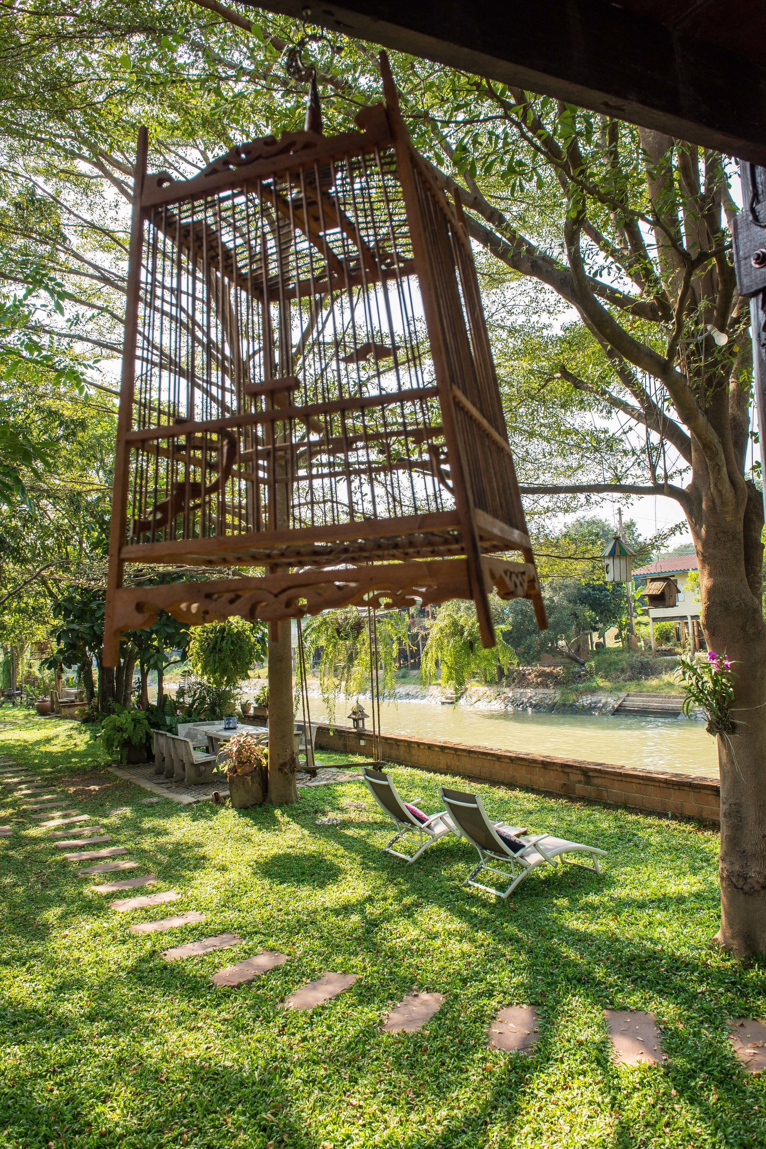 Traditional Thai House River View | Living area | Flat-screen TV