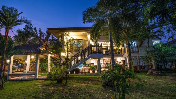 A two-story building with a balcony and a covered outdoor area. - Phuttal Residence (Ayutthaya)