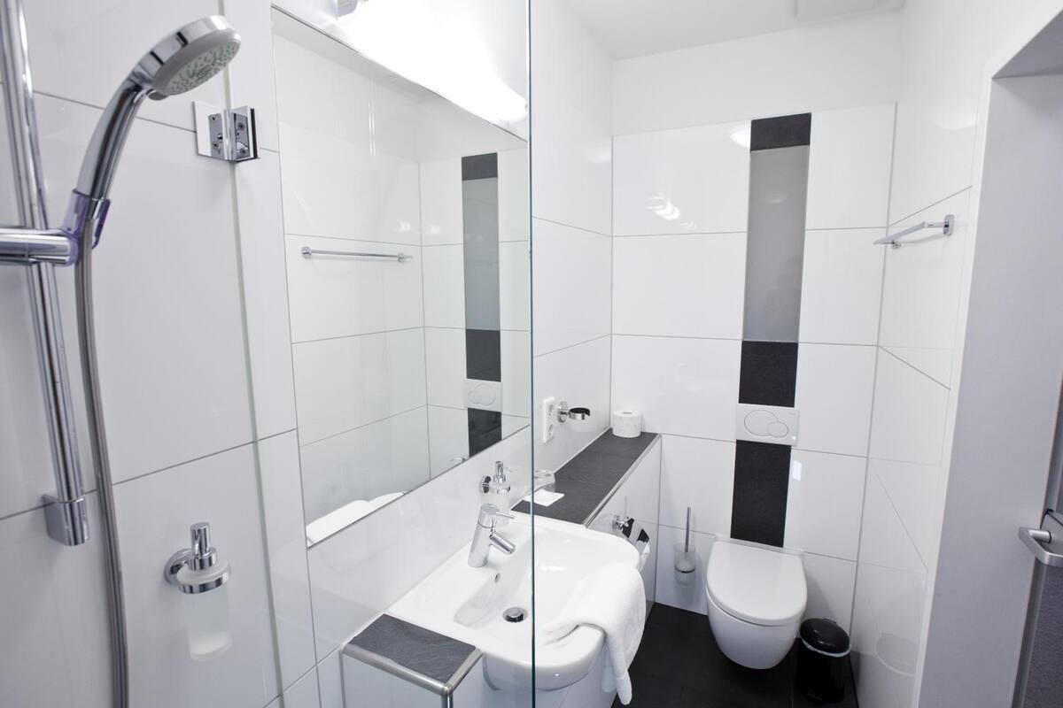 shower, hair dryer, heated floors, towels