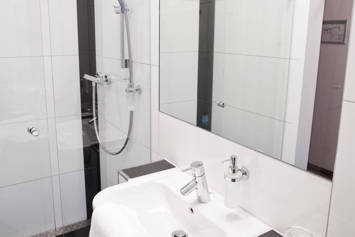 shower, hair dryer, heated floors, towels