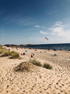 Na praia, areia branca 
