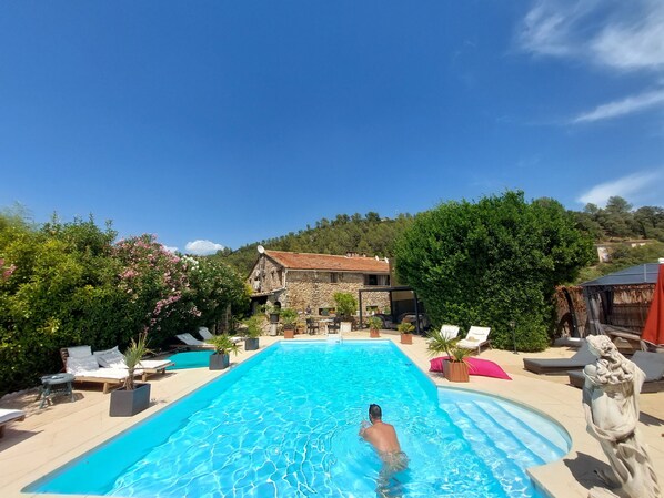 Seasonal outdoor pool, pool umbrellas, pool loungers