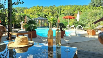 Seasonal outdoor pool, pool umbrellas, pool loungers