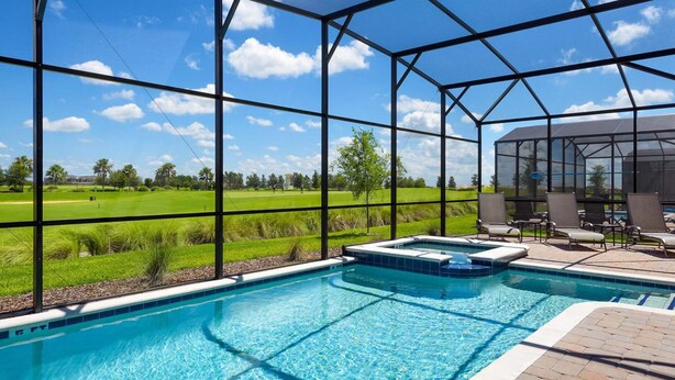 A swimming pool with a glass enclosure, a hot tub, and lounge chairs. - Grhcdw9161 - Champions Gate Resort - 6 Bed 6 Baths House (Davenport)