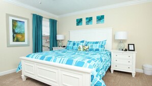 A bedroom with a bed, two nightstands, a dresser, and a framed picture on the wall. - Grhbuc2967 - Paradise Palms Resort - 6 Bed 5 Baths House (Kissimmee)