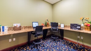 A reception area with two computer stations, chairs, a printer, and a vase with flowers. - Grhcpr8971 - Paradise Palms Resort - 4 Bed 3 Baths Townhouse (Kissimmee)