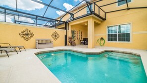 An indoor swimming pool with a glass ceiling, yellow walls, and a bench. - Grhbch3061 - Paradise Palms Resort - 4 Bed 3 Baths Townhouse (Kissimmee)