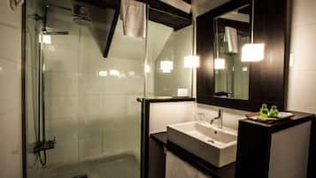 Deluxe Studio | Bathroom | Shower, hair dryer, towels, soap