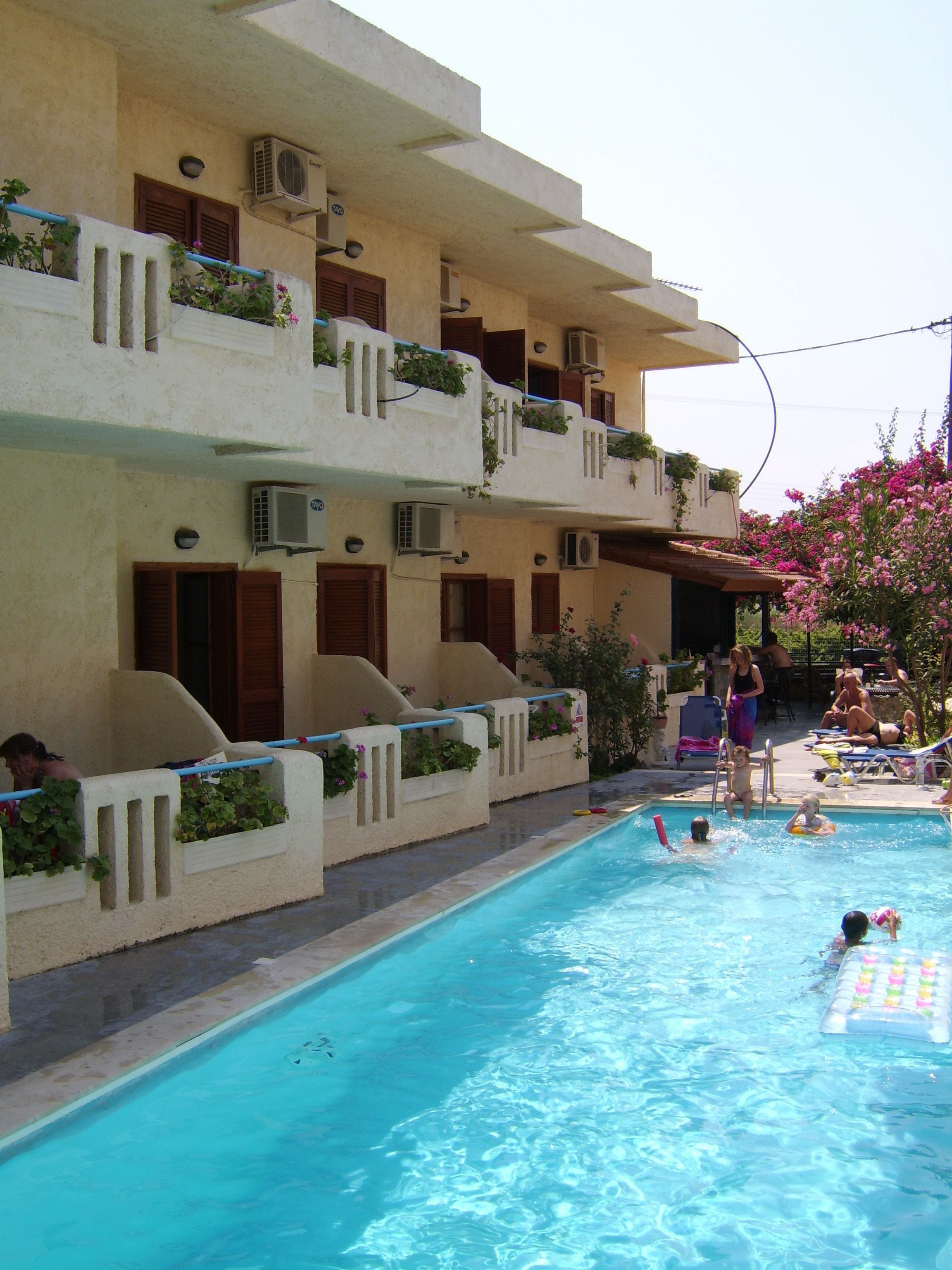 Outdoor pool, open 9 AM to 9 PM, pool umbrellas, sun loungers