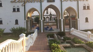 A building with the sign "Laguna Beach" and arches. - Apartment in Laguna Beach 1st Line Beach with WIFI (Torrox)
