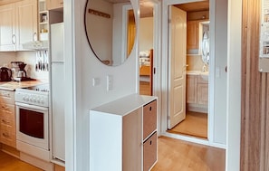 Fridge, stovetop, dishwasher, coffee/tea maker