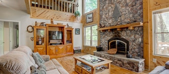 Dog-friendly riverfront cabin with waterfall view, large decks, firepit, Ping-Pong