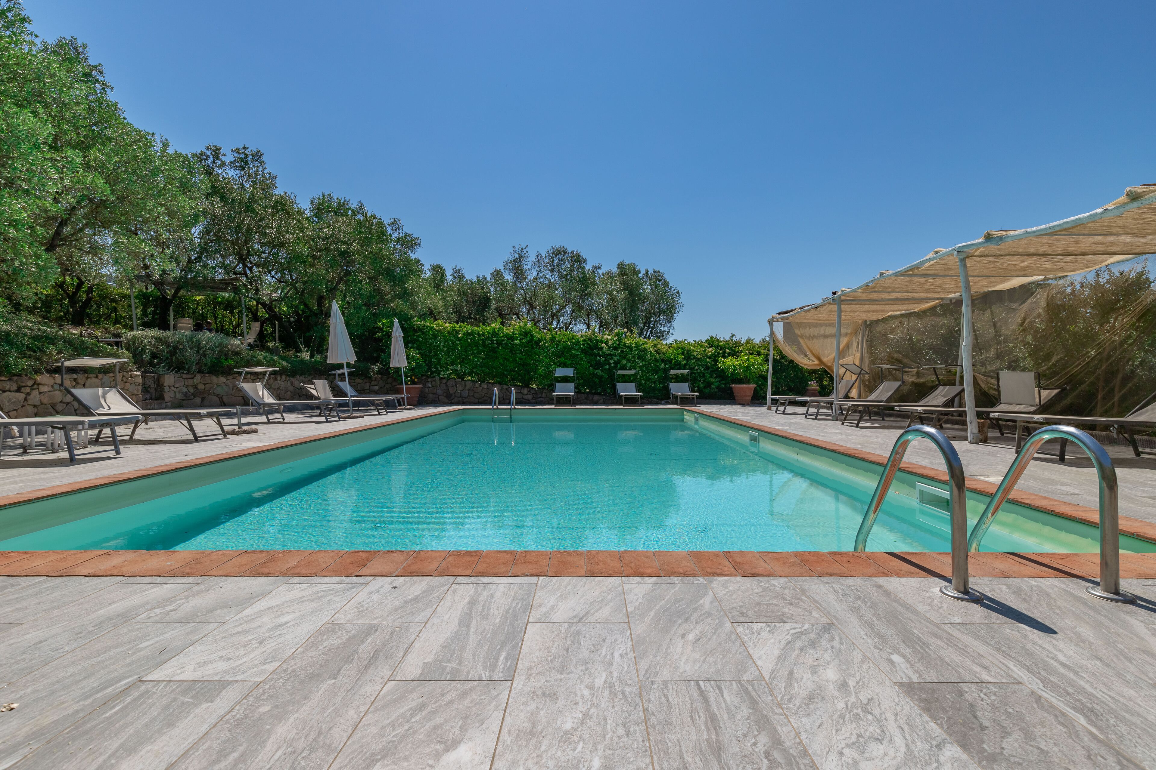 Indoor pool, outdoor pool, pool umbrellas, pool loungers