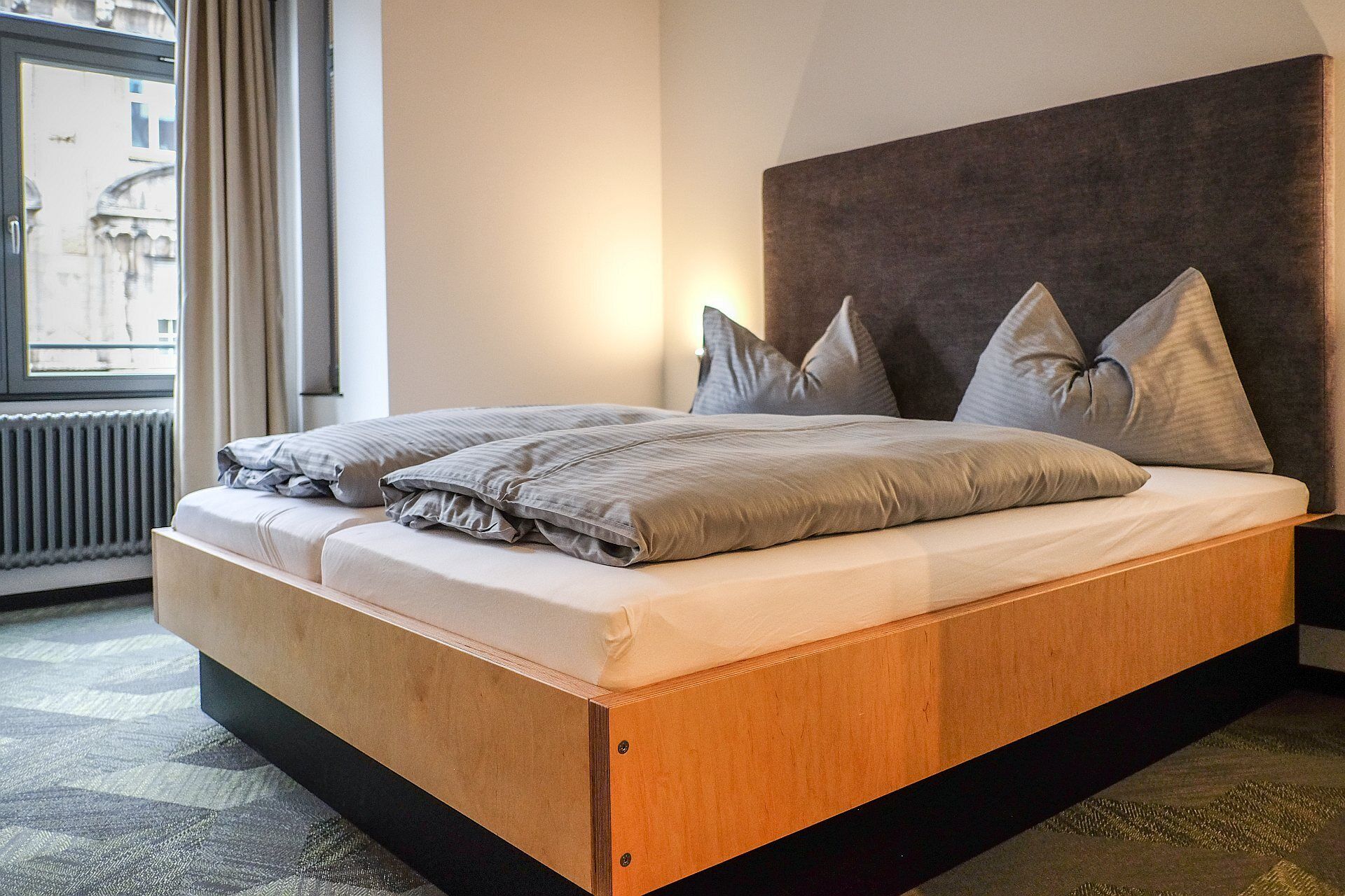 comfort double room | premium bedding, down duvets, desk, blackout curtains