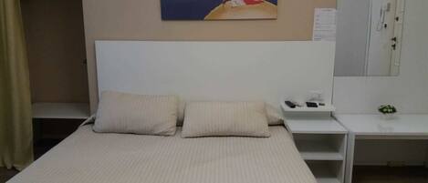 Triple Room | Minibar, in-room safe, desk, soundproofing