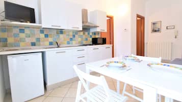 Apartment, 1 Bedroom (5 pax ) | Living area | Flat-screen TV