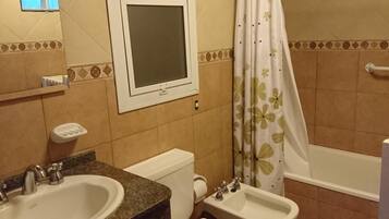 Shower, bidet, towels, toilet paper