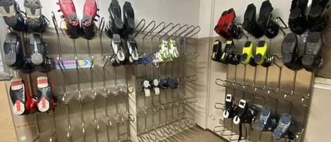 A shoe rack with multiple pairs of shoes organized by size.