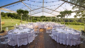 A tented outdoor dining area with round tables set for a formal event, surrounded by a wooden deck and a vineyard in the background. - Villa Poropati, Groznjan - Luxury Countryside Estate up to 19 persons
80m2 pool  (Groznjan)