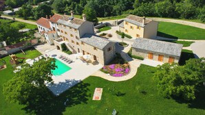 An aerial view of a large estate with multiple buildings, a swimming pool, and well-maintained gardens. - Villa Poropati, Groznjan - Luxury Countryside Estate up to 19 persons
80m2 pool  (Groznjan)