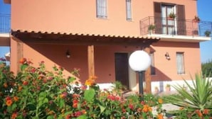 A two-story building with a balcony on the upper floor. - HOME RELAX: NATURE, GOOD FOOD FOLKLORE (Balestrate)