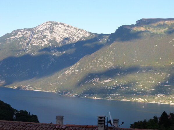 A mountainous landscape with a lake and a town in the valley.