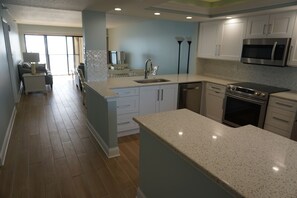 Fridge, microwave, oven, stovetop - One Bedroom Penthouse Condo on the Beach at Ocean Sands (Madeira Beach)
