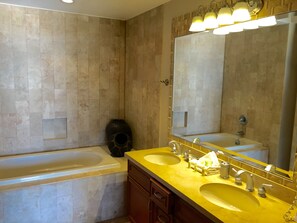 Bathtub, hair dryer, towels, soap