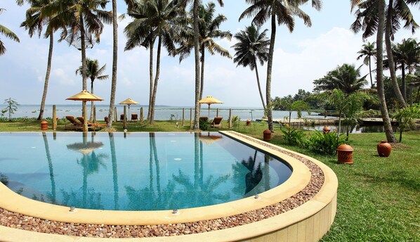 Outdoor pool, free pool cabanas, pool umbrellas